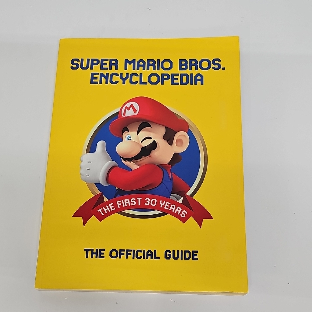 Super Mario Bros. Encyclopedia - The Official Guide, Paper Back, NEW